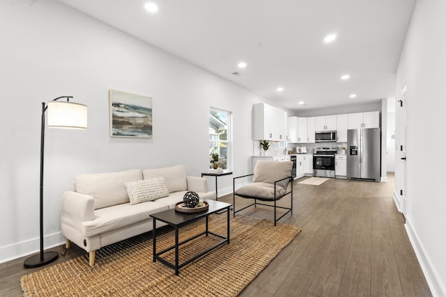 living room with dark hardwood / wood-style floors