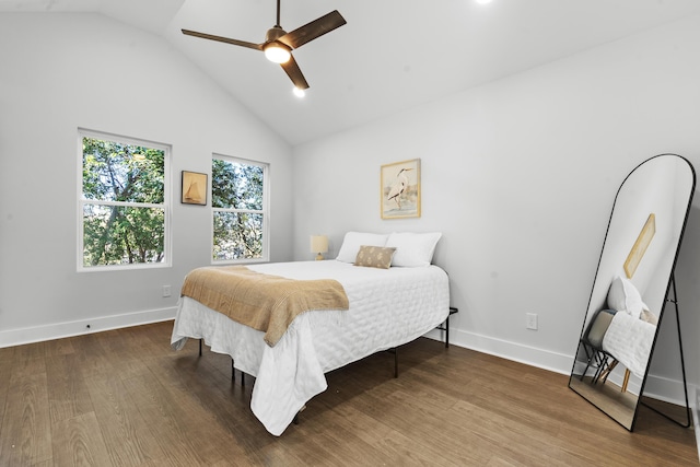 bedroom featuring hardwood / wood-style floors, high vaulted ceiling, and ceiling fan