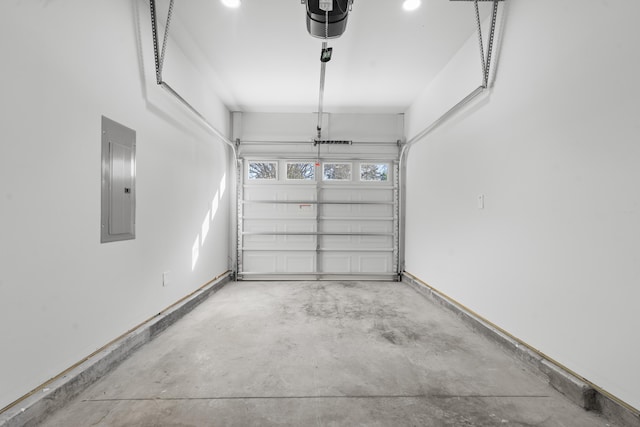 garage with electric panel and a garage door opener