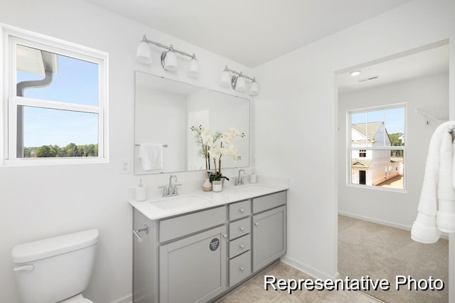 185 Surf Bird Rd Unit 506P, Summerville, SC 29486 - bathroom with double vanity, baseboards, toilet, and a sink