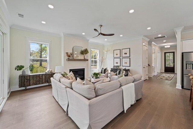 4235 Royal Harbor Rd, Hollywood, SC 29449 - living area with recessed lighting, crown molding, a ceiling fan, visible vents, and wood finished floors