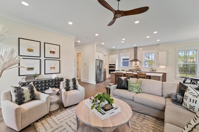 4235 Royal Harbor Rd, Hollywood, SC 29449 - living area with recessed lighting, light wood-style floors, a ceiling fan, and crown molding