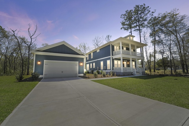 4235 Royal Harbor Rd, Hollywood, SC 29449 - view of front of home featuring concrete driveway, a balcony, a front lawn, a garage, and covered porch