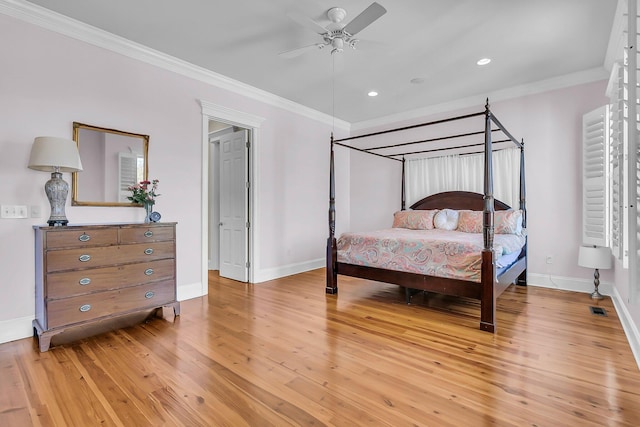 bedroom featuring visible vents, crown molding, baseboards, light wood-type flooring, and recessed lighting