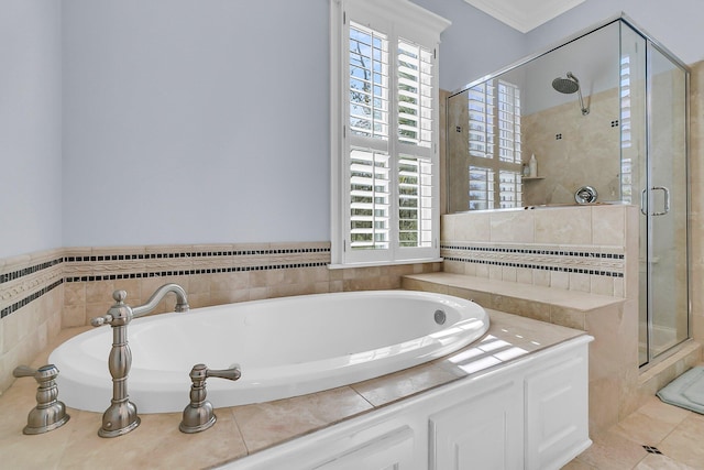 bathroom with a garden tub, a stall shower, crown molding, and tile patterned flooring