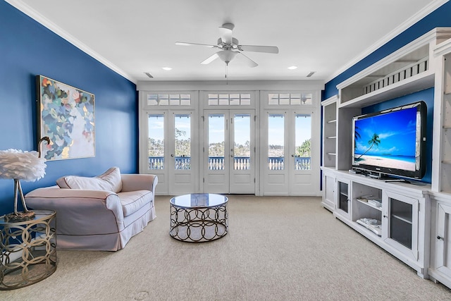 living area with carpet flooring, a ceiling fan, recessed lighting, and ornamental molding