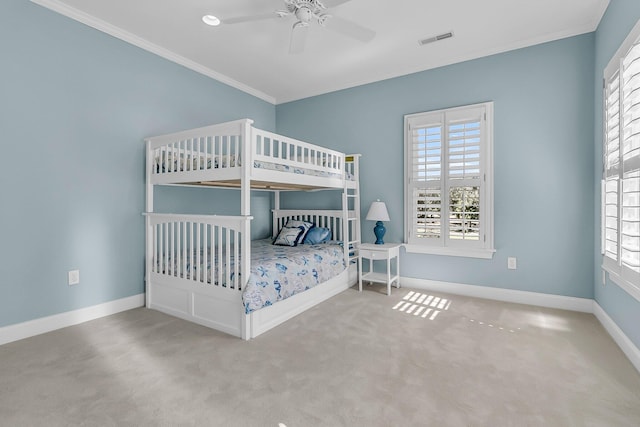 unfurnished bedroom featuring visible vents, crown molding, baseboards, and carpet floors