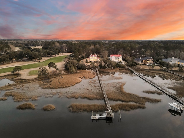 aerial view at dusk with a water view