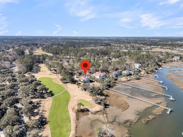 bird's eye view featuring golf course view and a water view