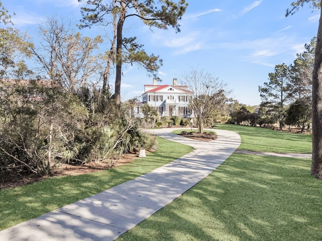 view of home's community featuring a yard