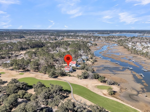 bird's eye view with view of golf course and a water view