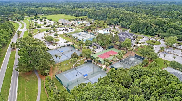 birds eye view of property with a wooded view