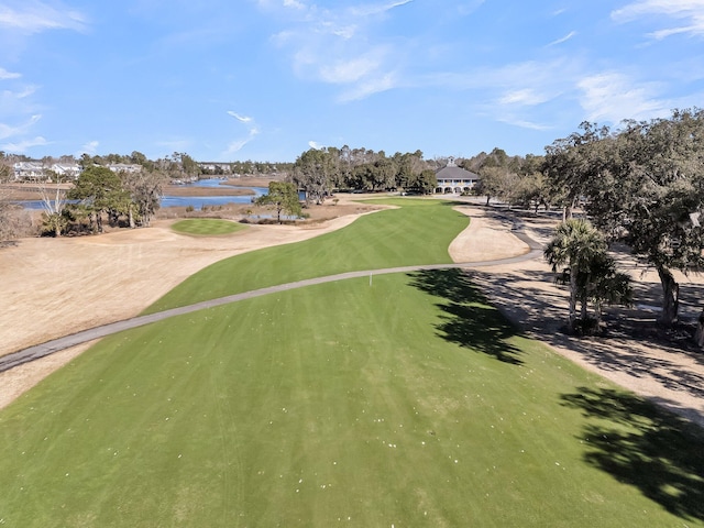 view of community with a water view and view of golf course