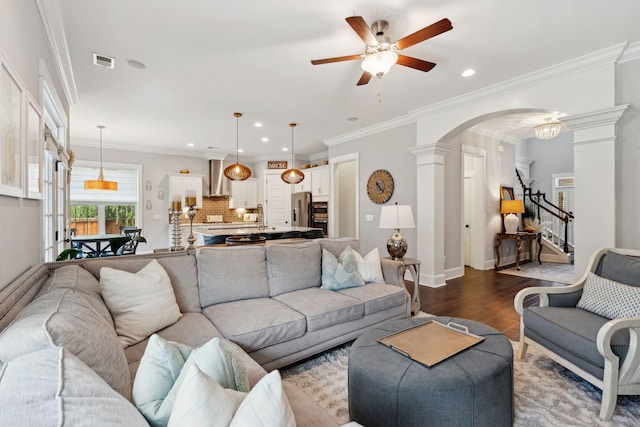 525 Yellow Tower Ter, Charleston, SC 29412 - living area with ornate columns, a ceiling fan, arched walkways, dark wood-type flooring, and stairs