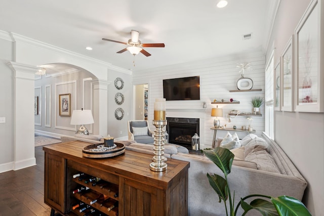 525 Yellow Tower Ter, Charleston, SC 29412 - living room with a ceiling fan, arched walkways, dark wood-style flooring, ornamental molding, and a fireplace