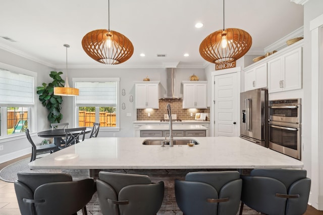 525 Yellow Tower Ter, Charleston, SC 29412 - kitchen with appliances with stainless steel finishes, wall chimney exhaust hood, white cabinets, a breakfast bar area, and ornamental molding