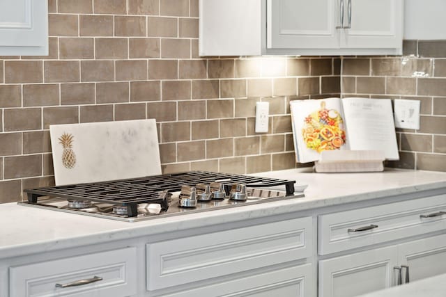 525 Yellow Tower Ter, Charleston, SC 29412 - kitchen view of decorative backsplash, stainless steel gas cooktop, and white cabinetry