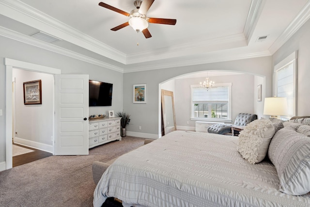 525 Yellow Tower Ter, Charleston, SC 29412 - bedroom featuring arched walkways, a tray ceiling, a chandelier, carpet flooring, and ornamental molding