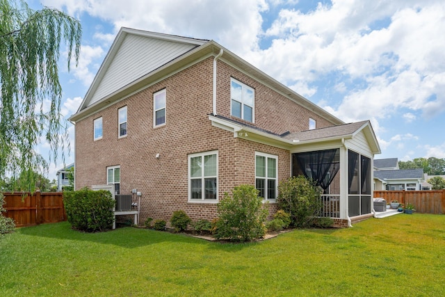 525 Yellow Tower Ter, Charleston, SC 29412 - back of property featuring brick siding, a fenced backyard, and a sunroom
