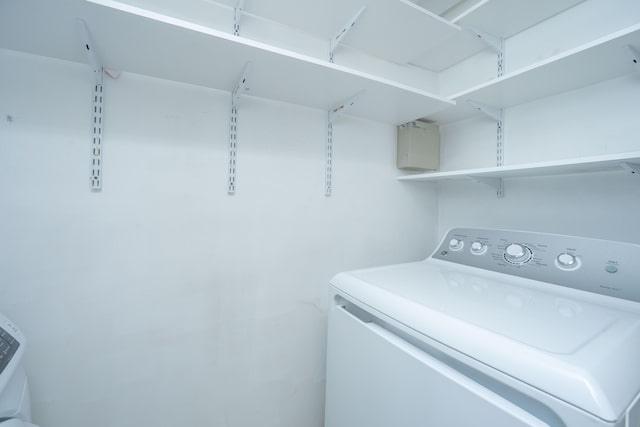 clothes washing area featuring laundry area and washer / dryer