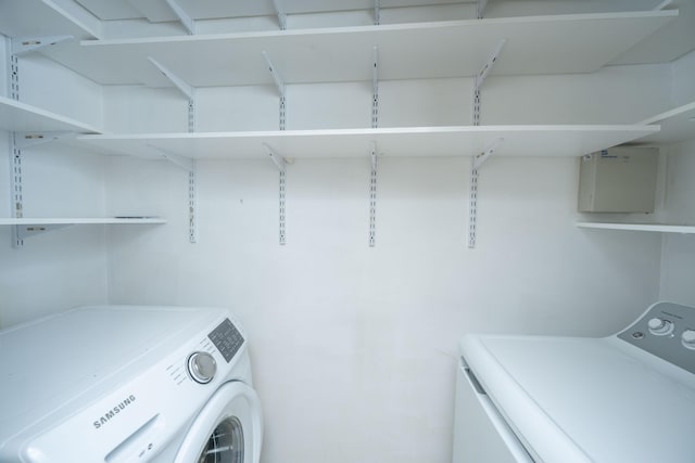 washroom with laundry area and separate washer and dryer