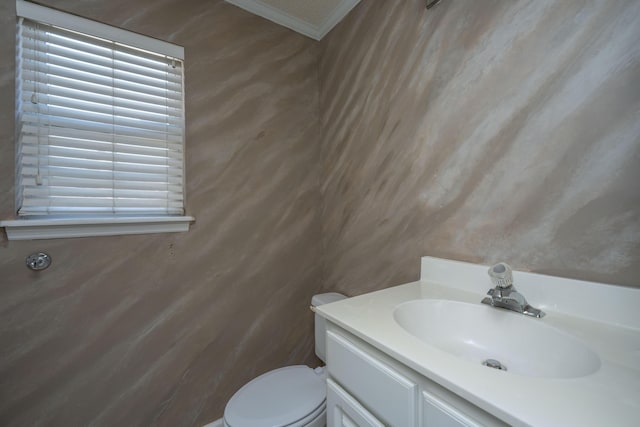 half bathroom with toilet and vanity