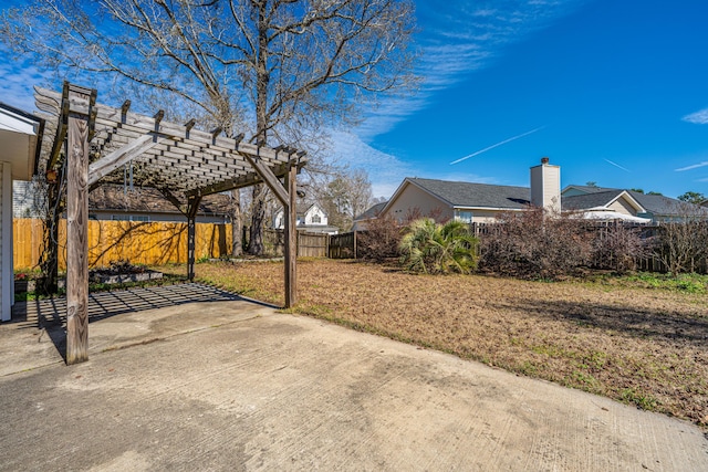 view of yard with a patio, fence private yard, and a pergola