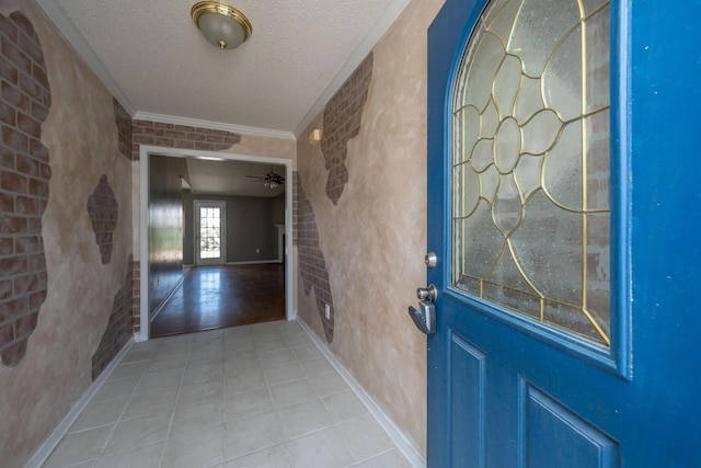 entryway featuring brick wall and a textured ceiling