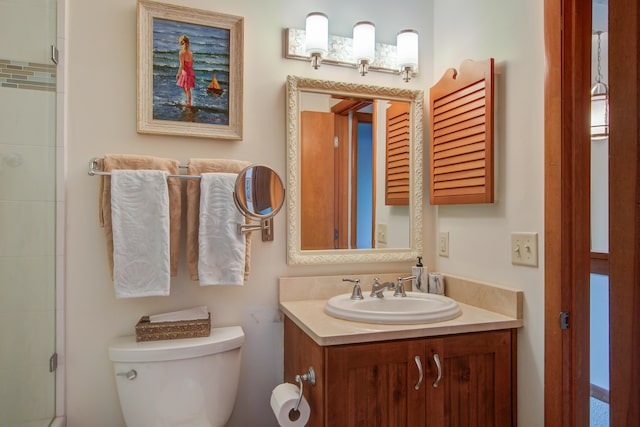 full bath featuring toilet, an enclosed shower, and vanity