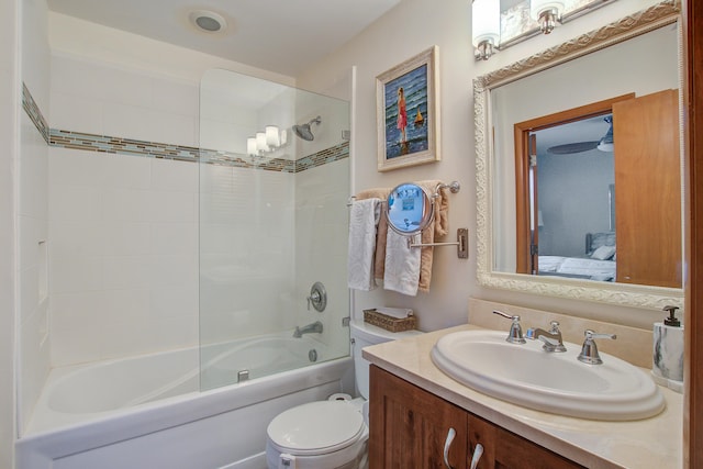 ensuite bathroom with ensuite bathroom, washtub / shower combination, vanity, and toilet