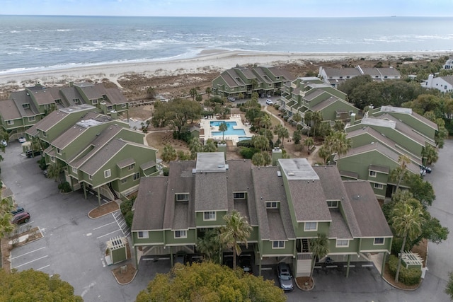 bird's eye view featuring a water view, a residential view, and a view of the beach