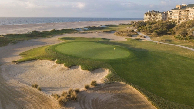 view of home's community featuring a water view and golf course view