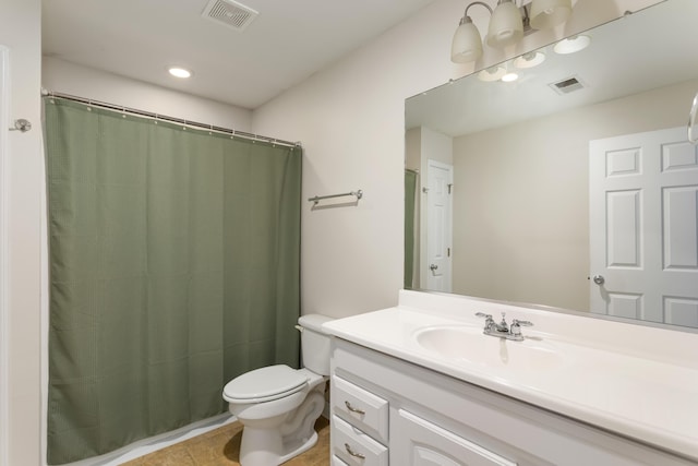 bathroom with tile patterned floors, toilet, and vanity