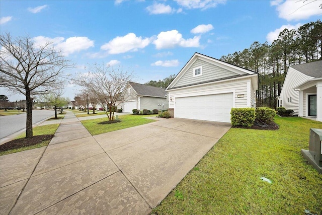 view of side of property featuring a lawn and a garage