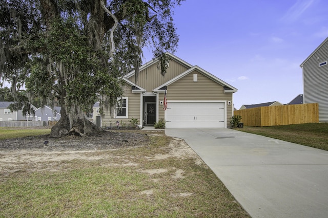 view of front facade featuring a front yard and a garage