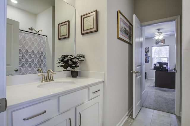 bathroom with tile patterned flooring, vanity, ceiling fan, and a shower with shower curtain