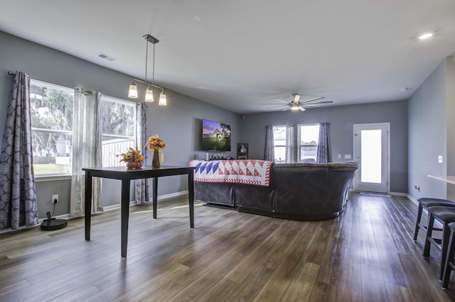 living room with hardwood / wood-style floors and ceiling fan