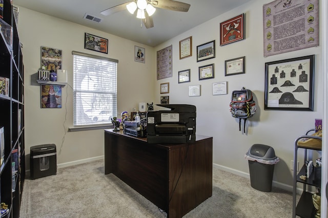 carpeted office with ceiling fan