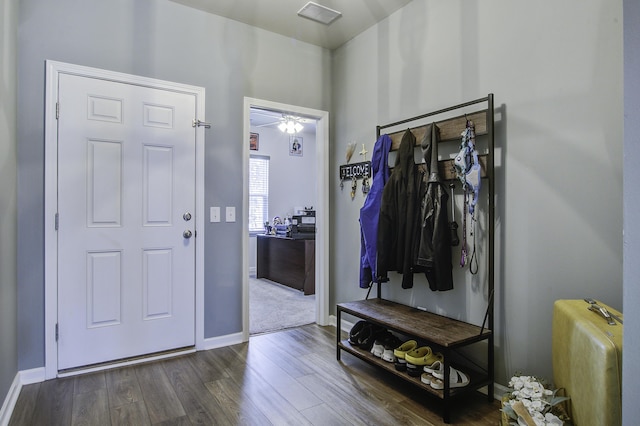 foyer with dark hardwood / wood-style floors and ceiling fan