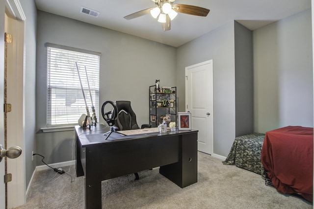 office featuring light carpet and ceiling fan