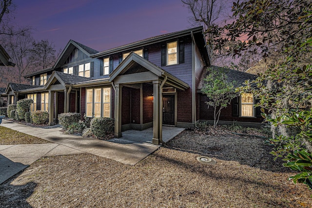 view of front of property with a sunroom