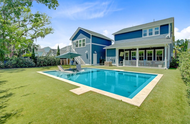 2557 Hatch Dr, Johns Island, SC 29455 - rear view of house with a lawn, an outdoor pool, and a patio area