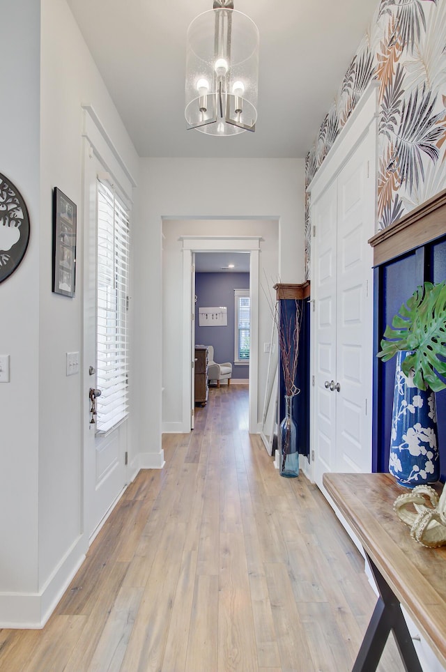 2557 Hatch Dr, Johns Island, SC 29455 - foyer entrance with baseboards, an inviting chandelier, and light wood-style floors
