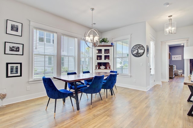 2557 Hatch Dr, Johns Island, SC 29455 - dining room with baseboards, a chandelier, and light wood-style floors