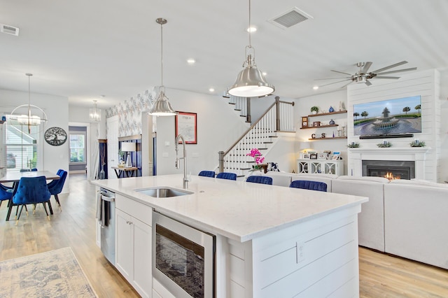 2557 Hatch Dr, Johns Island, SC 29455 - kitchen featuring a sink, an island with sink, stainless steel appliances, open floor plan, and visible vents