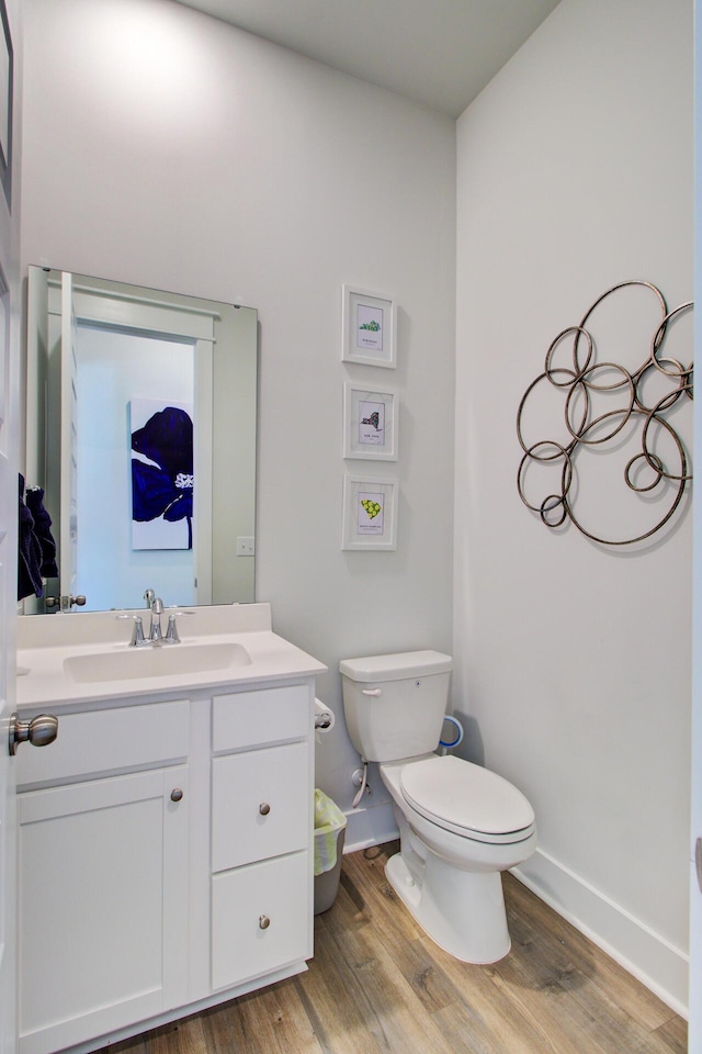 2557 Hatch Dr, Johns Island, SC 29455 - bathroom featuring baseboards, vanity, toilet, and wood finished floors