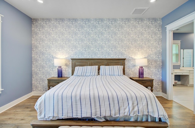 2557 Hatch Dr, Johns Island, SC 29455 - bedroom with an accent wall, recessed lighting, wood finished floors, and visible vents