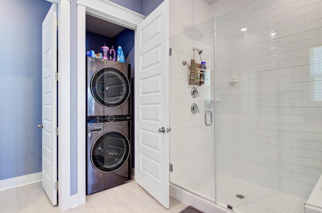 2557 Hatch Dr, Johns Island, SC 29455 - full bath featuring baseboards, stacked washer / dryer, and a shower stall