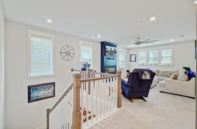 2557 Hatch Dr, Johns Island, SC 29455 - living area featuring a fireplace, light carpet, a ceiling fan, and recessed lighting
