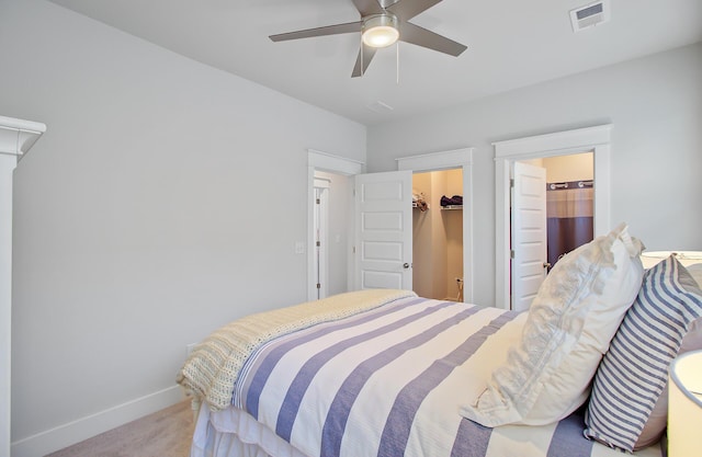 2557 Hatch Dr, Johns Island, SC 29455 - carpeted bedroom with visible vents, a closet, baseboards, a walk in closet, and a ceiling fan